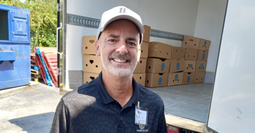 Nick Mullins volunteering at The Sharing Center Pantry