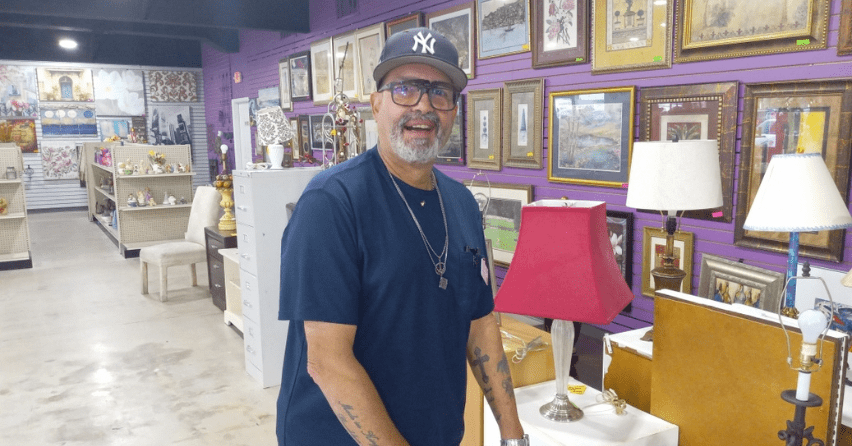 Volunteer Richard Sanchez serving at The Sharing Center