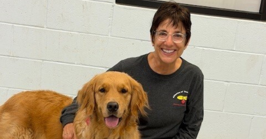 Volunteer spotlight featuring Melissa Robinson and her pet therapy dog Basil at The Sharing Center
