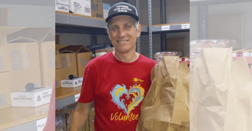 Sean Davis volunteering in The Sharing Center's Food Pantry by stocking shelves and preparing food baskets for neighbors in need.